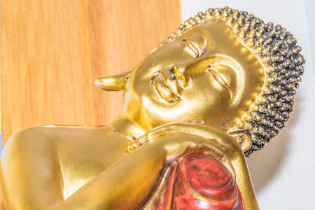 the gold sleeping buddha in the Thai temple donated from Thai community. Public buddhaの写真素材