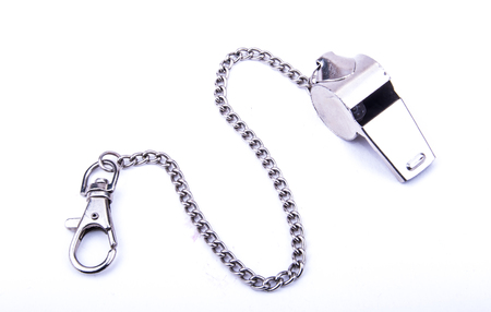 the beautiful world cup whistle with stainless steal ornamental chainon the white backgroundの写真素材