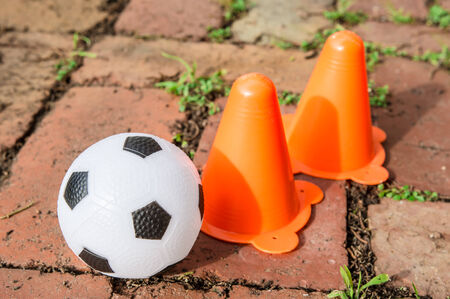 the black and white soccer ball with funnel on the groundの写真素材