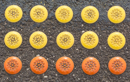mixed rubber button color on the ground at the train station