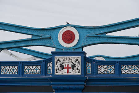 a particular of the steel structure of the tower bridge painted in 1977 wiht the red, white and blue...