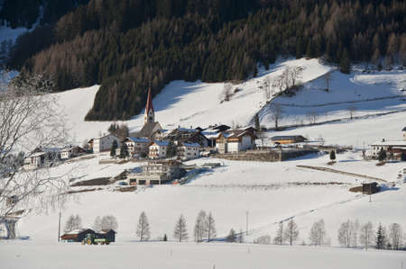 the village of kematen under the snow, in pfitsch, sudtirolの写真素材