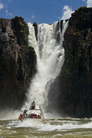 the magnificent garganta del diablo at the iguazu falls, one of the seven natural wonders of the world, between Argentina and Brazilの写真素材