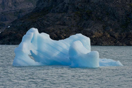 Spectacular blue iceberg floating on the Lake Argentino in the Los Glaciares National Park, Patagonia, Argentina.の写真素材