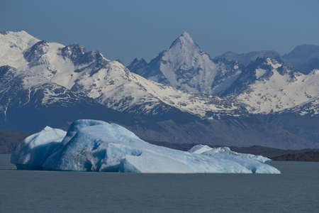 Spectacular blue iceberg floating on the Lake Argentino in the Los Glaciares National Park, Patagonia, Argentina.の写真素材