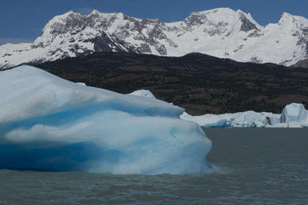 Spectacular blue iceberg floating on the Lake Argentino in the Los Glaciares National Park, Patagonia, Argentina.の写真素材