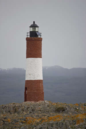 Lighthouse Les Eclaireurs on an islet in the Beagle Channel, near Ushuaia in the Tierra del Fuegoの写真素材
