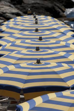 Cabanas and beach umbrella in the ligurian Riviera in Italy