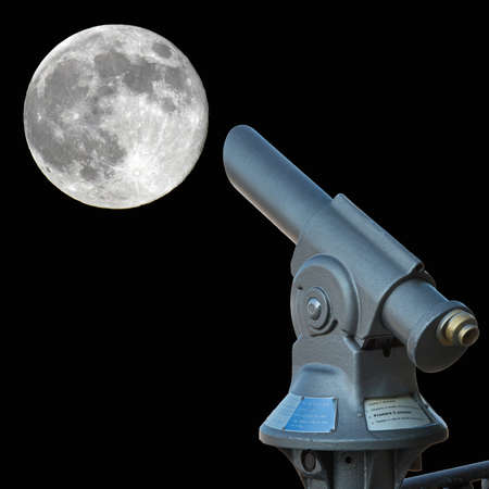 old fashioned telescope looking at the full moonの写真素材