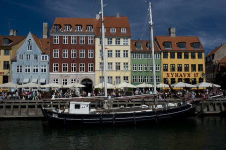 the skyline of the nyhavn, historical channel in the center of Copenhagen, Denmark, full of ancient multicolored housesのeditorial素材