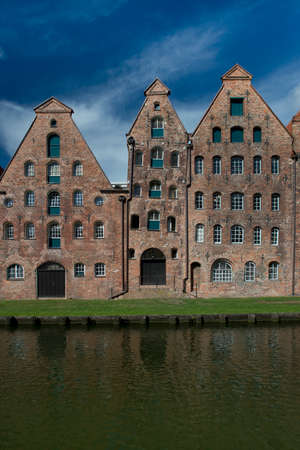 The ancient buildings of the salt warehouse in the center of the hanseatic city of Lubeck, in Germanyの写真素材