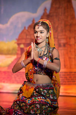 KHAJURAHO, INDIA - 24 OCTOBER 2013 - Unidentified dancer in traditional dresses, dance at the Khajuraho Teathre performing on typical indian music のeditorial素材