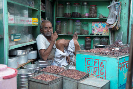BIKANER, INDIA - 17 OCTOBER 2013 - Unidentified typical indian man in a shop of the ancient town of Bikaner, Rajasthanのeditorial素材