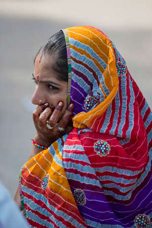 MANDAWA, INDIA - 17 OCTOBER 2013 - Portrait of unidentified young indian girl with the hands with henna decorated waiting at the mandawa market のeditorial素材
