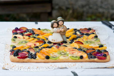 Bride and groom on a wedding cake topperの写真素材