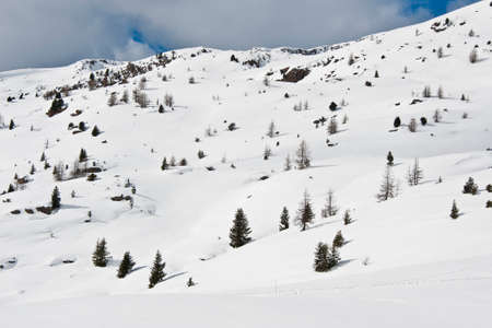 The idyllic snowy panorama in the Dolomiti の写真素材