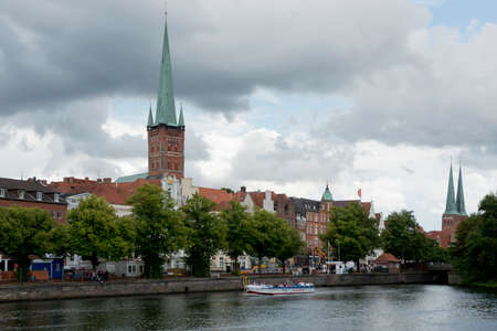 Buildings and church in the old town of Lubeck, Germanyのeditorial素材