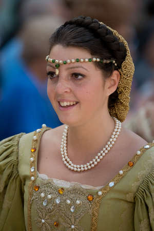GENOA, ITALY - 8 JUNE  2014 - Unidentified woman masked during the historical parade of the Maritime Republics Palioのeditorial素材