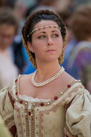 GENOA, ITALY - 8 JUNE  2014 - Unidentified woman masked during the historical parade of the Maritime Republics Palioのeditorial素材