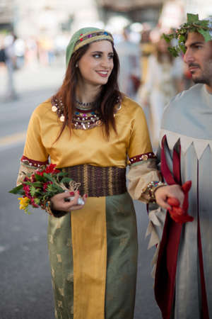 GENOA, ITALY - 8 JUNE  2014 - Unidentified woman masked during the historical parade of the Maritime Republics Palioのeditorial素材