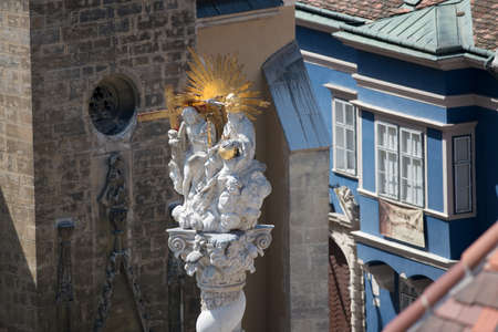 The statues on the top of the holy trinity column in the main square of the old town of Sopron in Western Transdanubia of Hungary.の写真素材