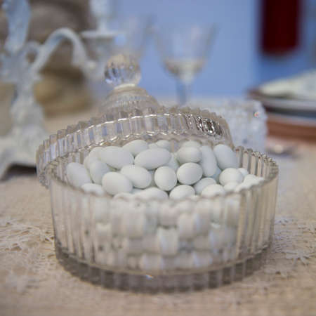 Sugared almonds on a wedding banquet tableの写真素材