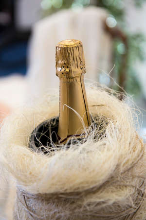 Bottle of sparkling wine on a wedding banquet tableの写真素材