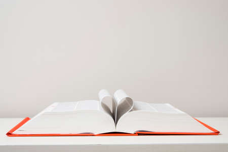 Heart shaped sheets in an opened bookの写真素材
