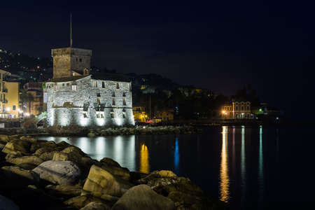The ancient castle of Rapallo, built on the ligurian sea illuminated by night.のeditorial素材