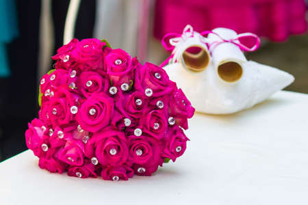 Fuxia wedding bouquet with precious stonesの写真素材