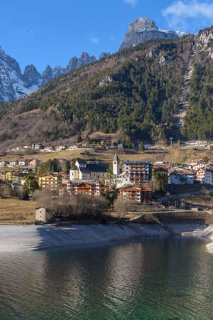 View over the alpine village of Molveno on the lake in the Brenta Groupの写真素材