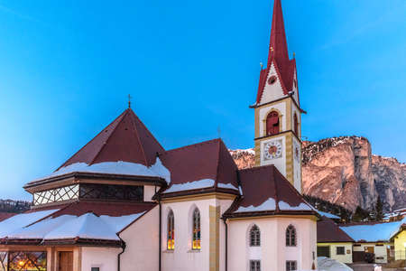 Church in the alpine village of Selva in Val Gardena, heart of the Dolomitesの写真素材