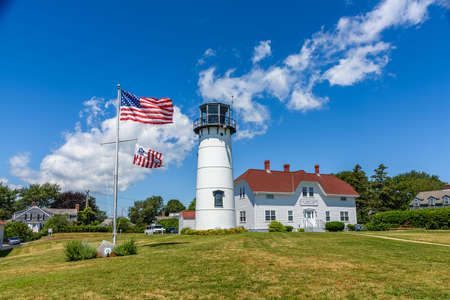 The lighthouse of Chatham and the american flag wavingの写真素材