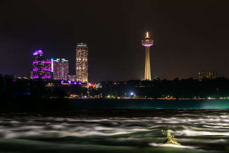 The falls of Niagara illuminated by nightの写真素材