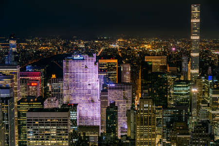 New York City, USA - July 5 2017 - Nightview of buildings and skyscrapers in Manhattan illuminated