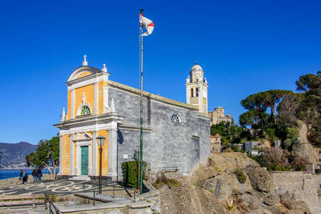 The church of San Giorgio on a promontory facing the village of Portofino on the italian Rivieraの写真素材