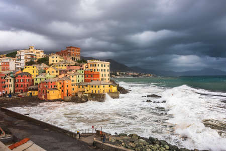 Waves and coastal storm on the fishing village of Boccadasse in Genoa, Liguriaの写真素材