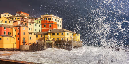 Waves and coastal storm on the fishing village of Boccadasse in Genoa, Liguriaの写真素材