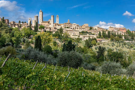View over the tuscan medieval village of San Gimignano with its towers.の写真素材