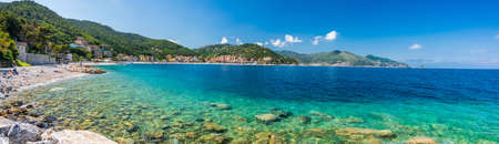 The wonderful seewater of the italian riviera in Noli, Liguria during summerの写真素材