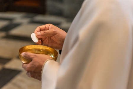 The elevation of the Sacramental Bread during the catholic liturgyの写真素材