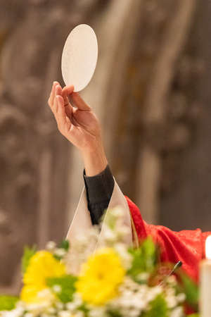 The elevation of the Sacramental Bread during the catholic liturgyの写真素材