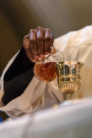The elevation of the Goblet with the sacramental wine during the Catholic Liturgy of the Eucharistの写真素材