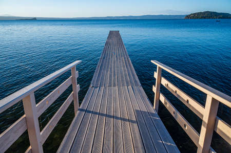 Wooden Pier on the Bolsena Lake near Marta, in province of Viterbo, Lazio, Italyの写真素材