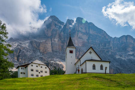 The sanctuary of  Santa Croce under Sas dla Crusc, in the Dolomites of Val Badia, Italyの写真素材