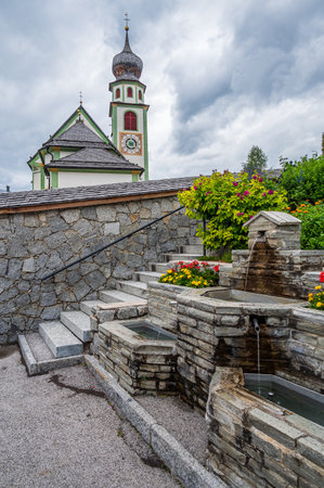church in the mountain village of San Cassiano, Val Badia, in the heart of Dolomitesの写真素材