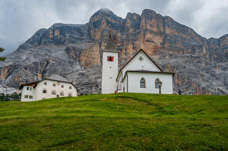 The sanctuary of  Santa Croce under Sas dla Crusc, in the Dolomites of Val Badia, Italyの写真素材