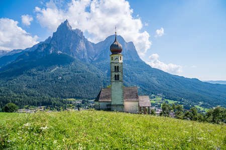 Church of San Valentino in the mountain village of Kastelruth in the heart of Dolomitesの写真素材