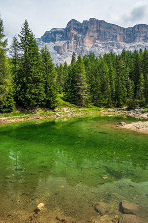 Little alpine lake dla le, near Badia in the Dolomites of Sas dla Cruscの写真素材