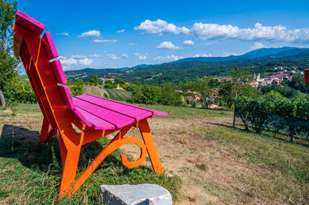 Lilac and Orange Big Bench in Monastero Vasco, little village of Piedmontの写真素材